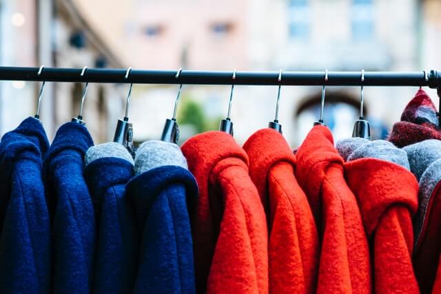 winter coats hanging on a rack
