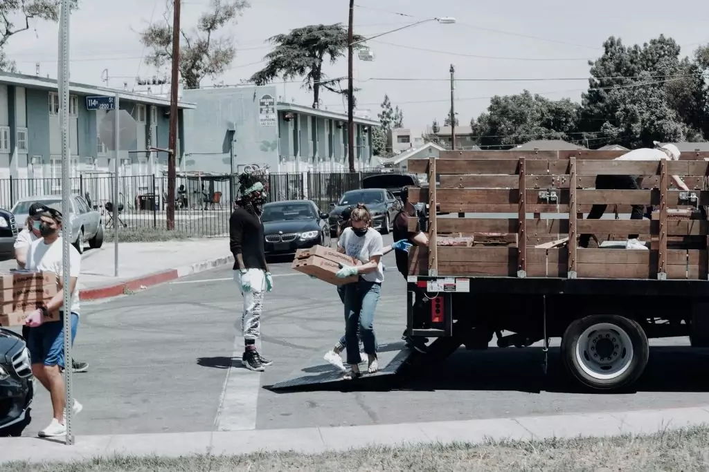 volunteers taking food off truck for food pantry delivery