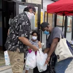 man volunteering at edmnyc food pantry in the bronx