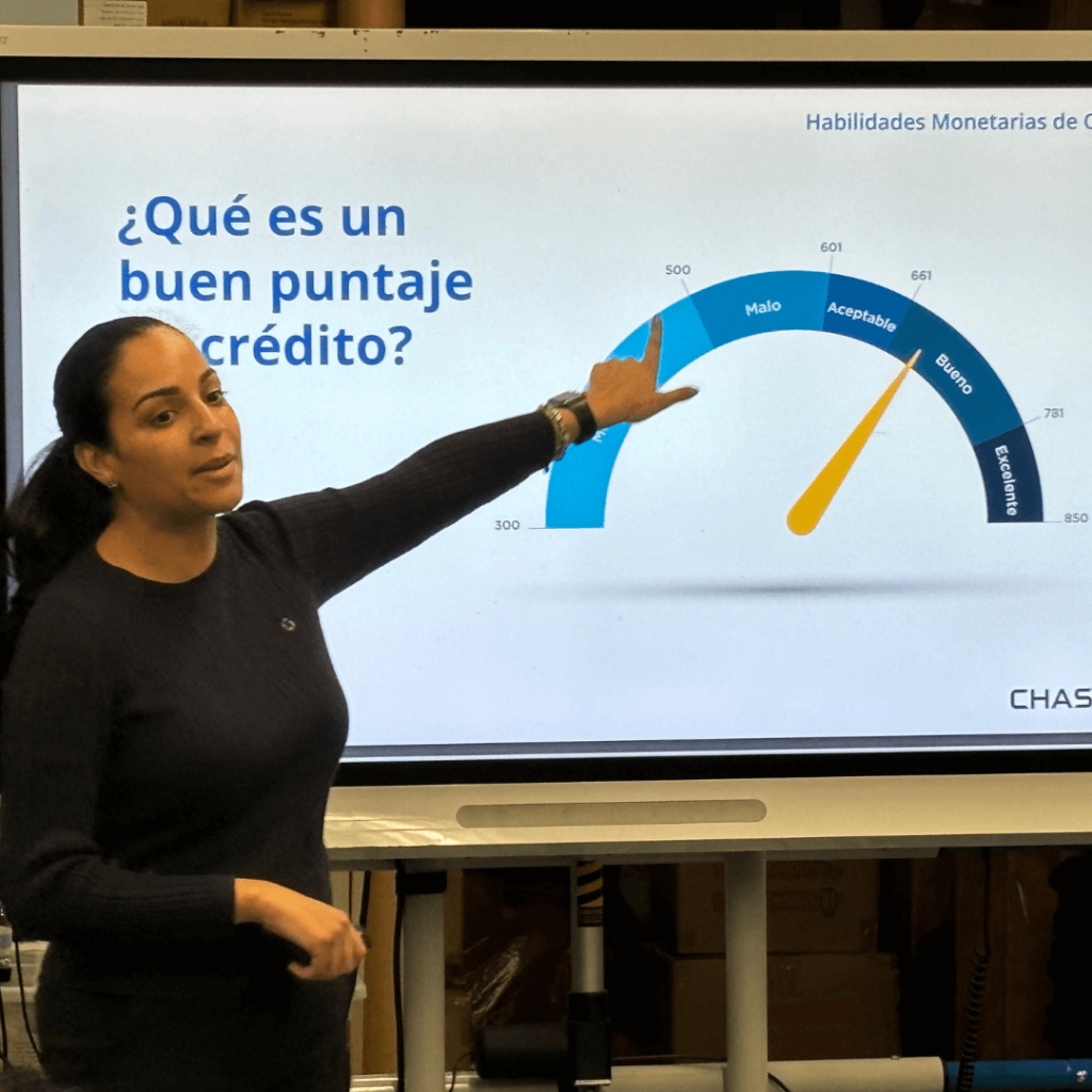 teacher in front of slide show teaching about credit