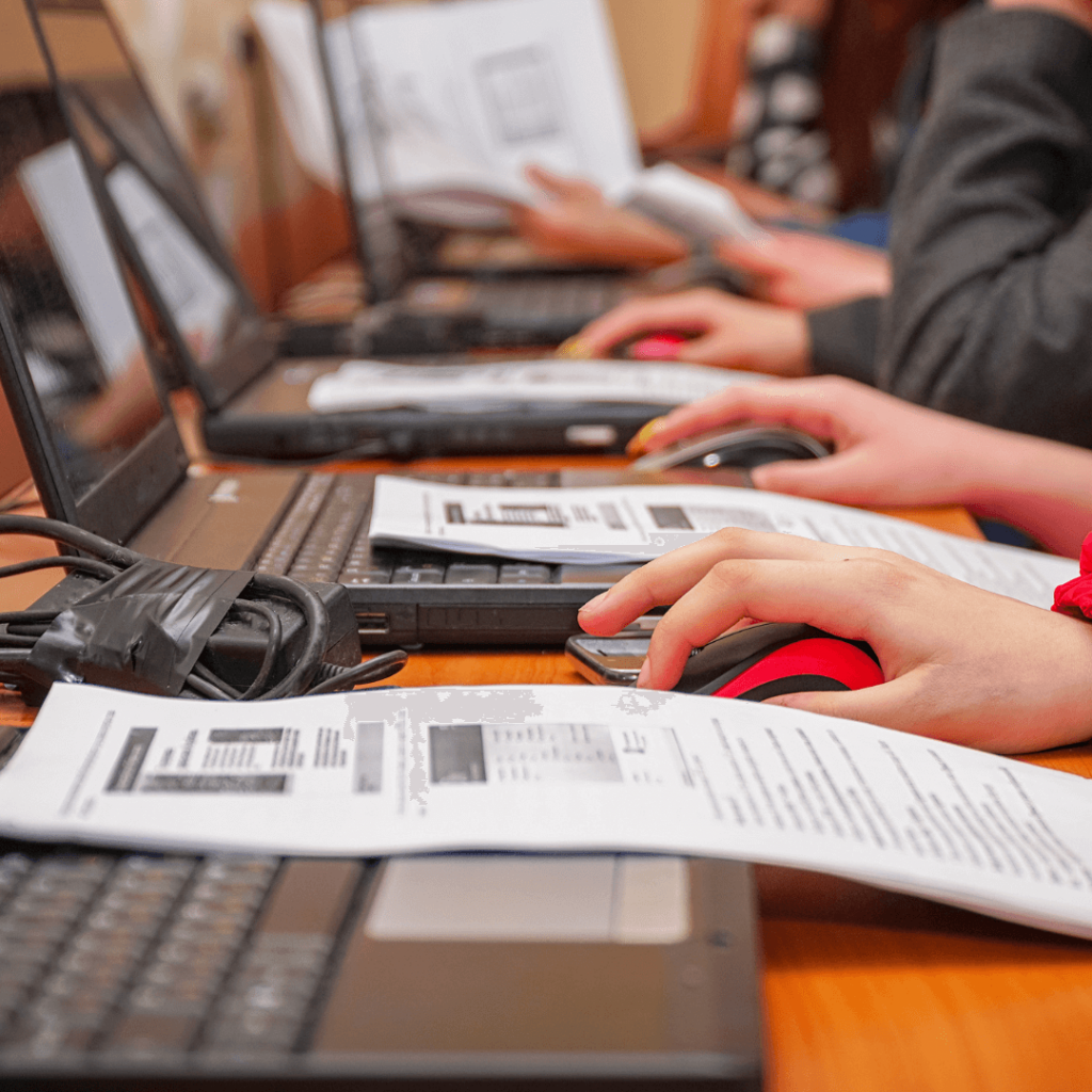 people learing how to type in a computer class